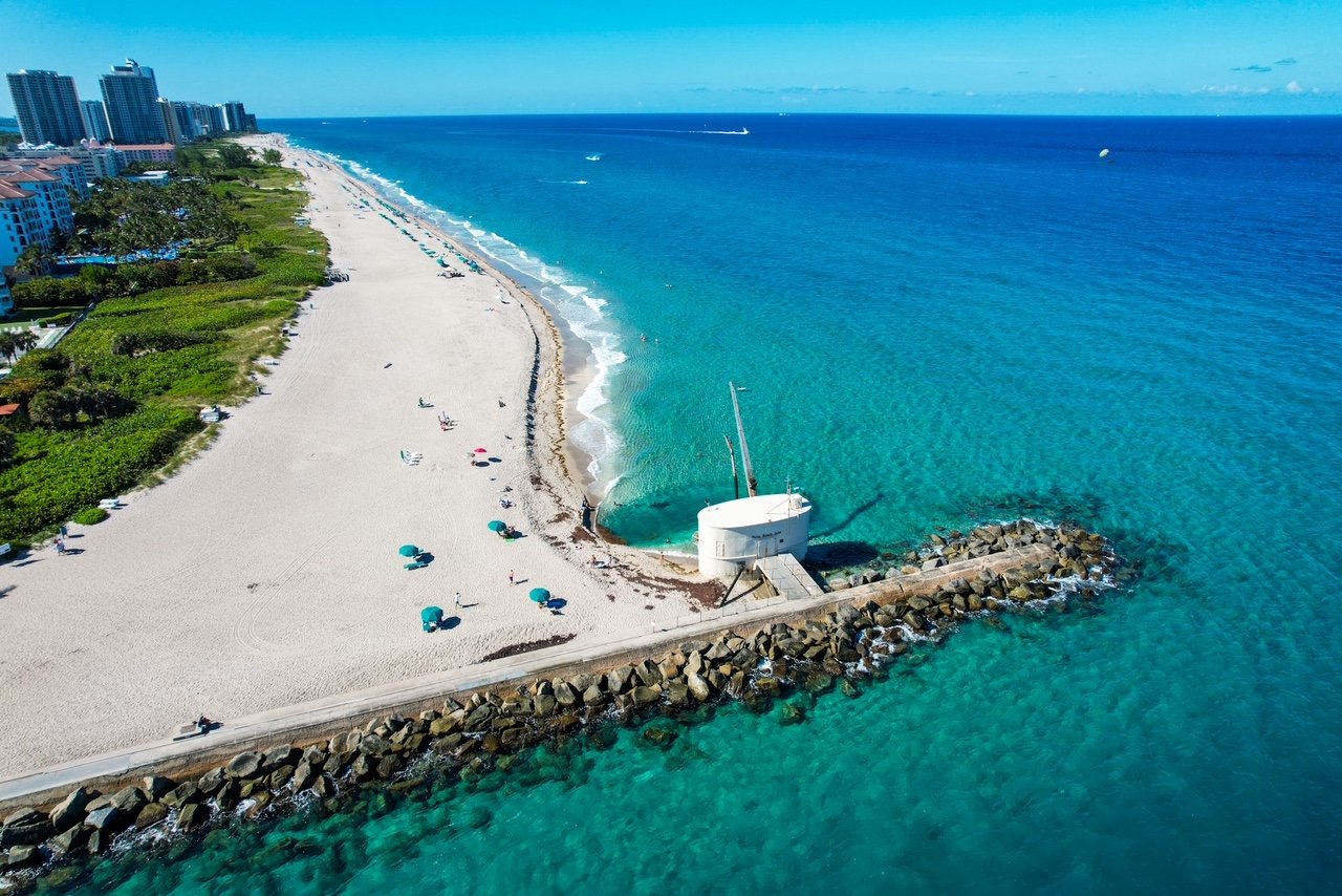a view of a beach next to a body of water
