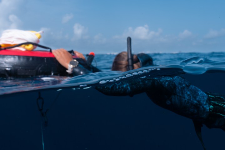 a man riding on the back of a boat