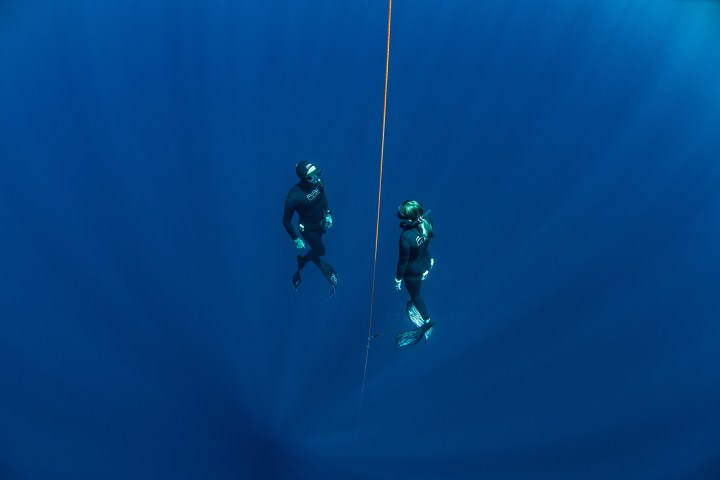 a man flying through the air while riding skis