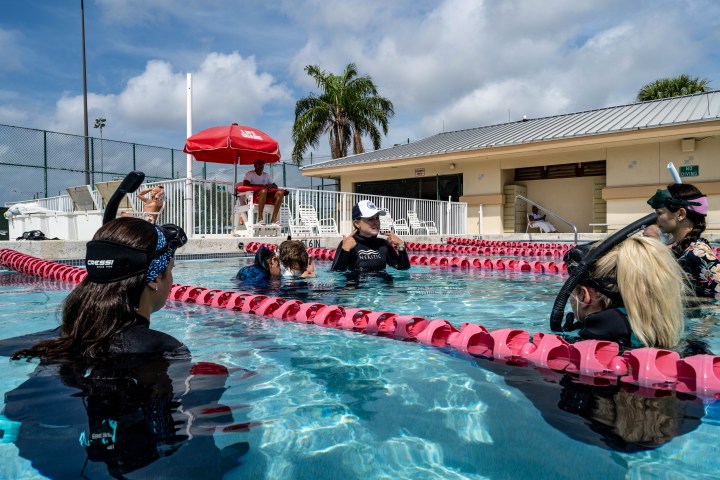 a person swimming in a pool of water
