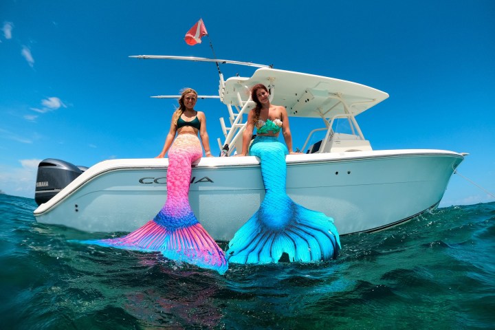 a group of people on a boat in the water