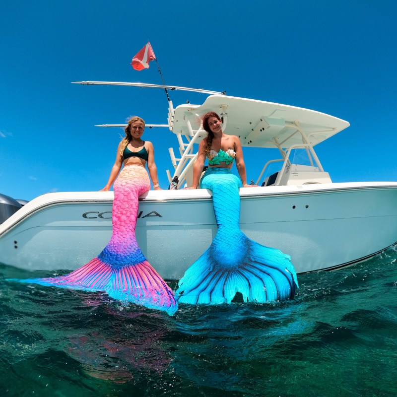 a group of people on a boat in the water