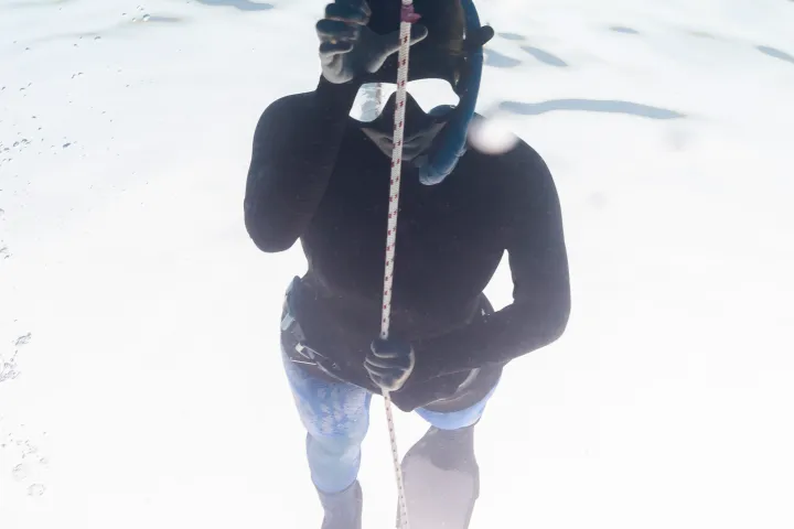 a person riding skis down a snow covered slope