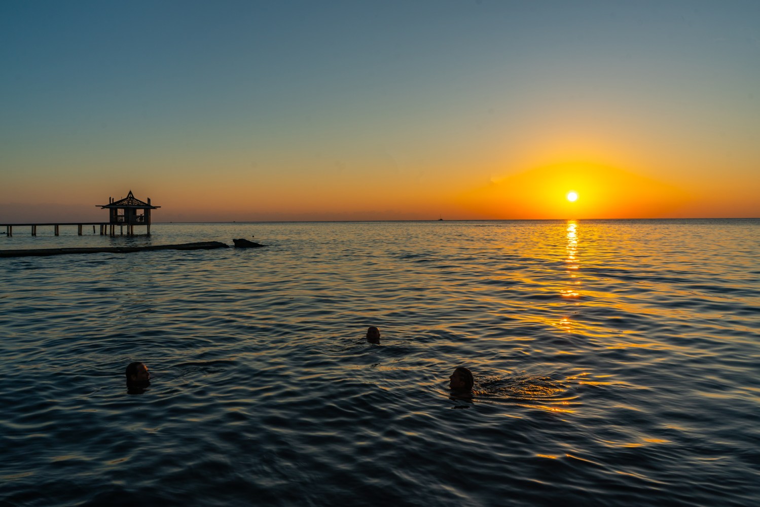 a sunset over a body of water