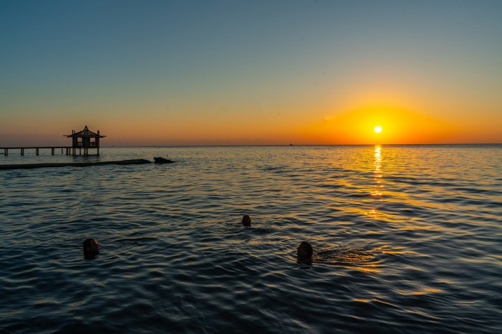 a sunset over a body of water