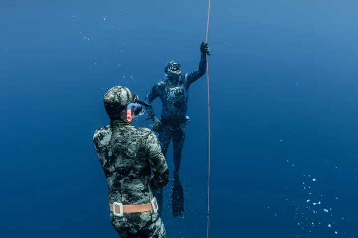 a man that is standing in the water