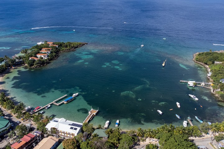 a large body of water with a city in the background