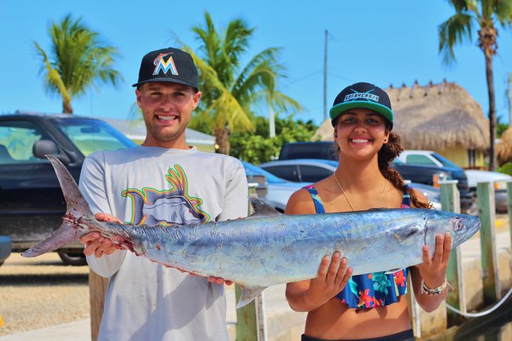 a person holding a fish
