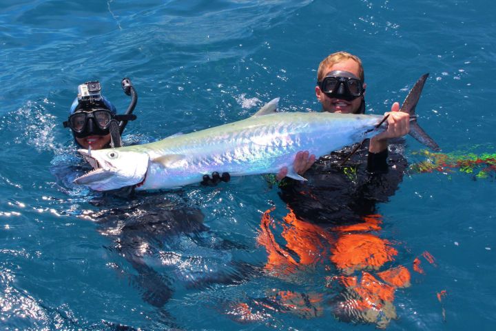 a man swimming in a body of water