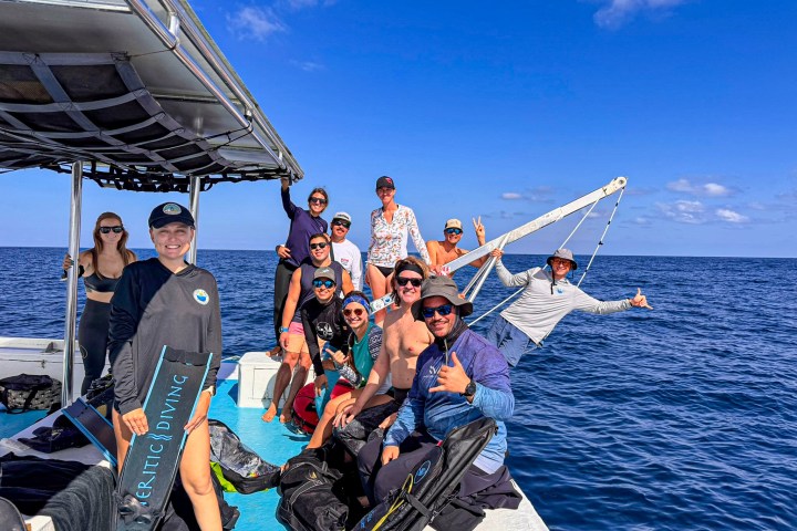 a group of people on a boat in the water