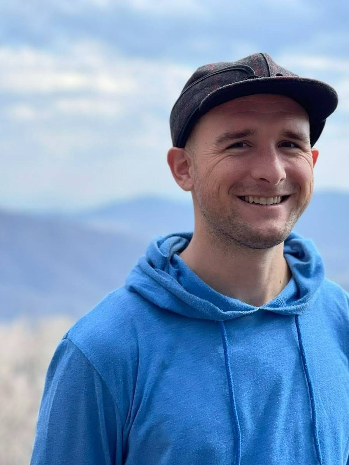 a man wearing a blue hat