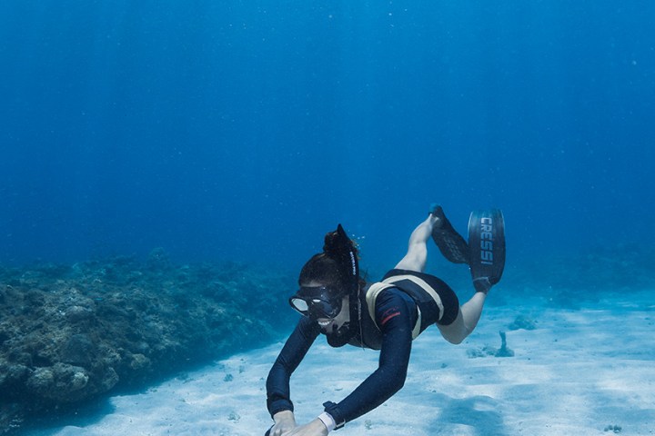 a man swimming in the snow
