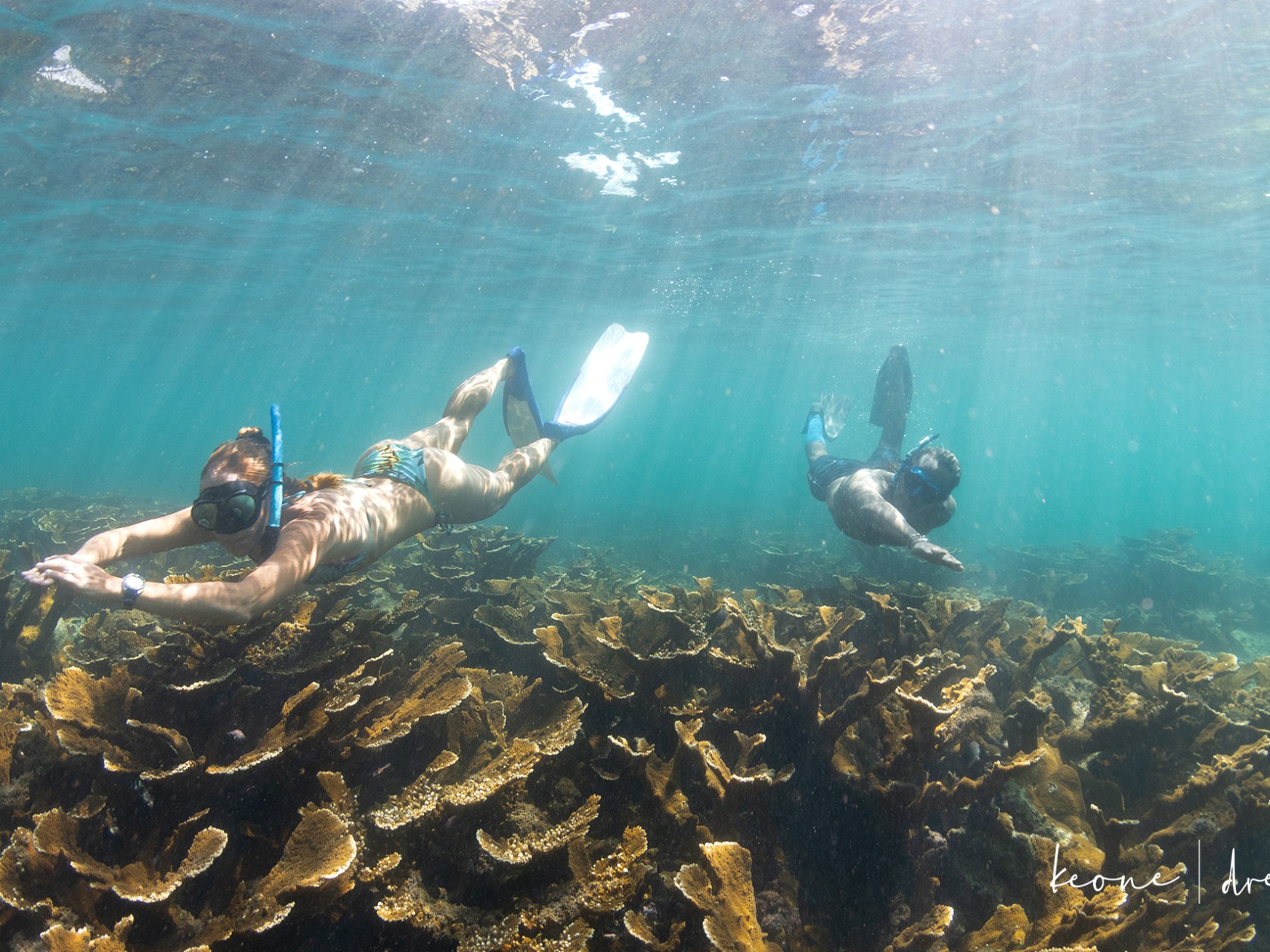 a man riding a wave on top of a body of water