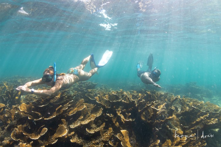 a man riding a wave on top of a body of water