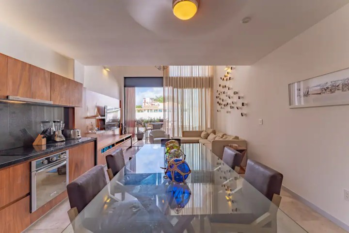a kitchen with an island in the middle of a room