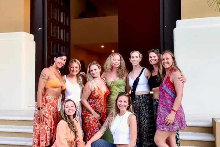 a group of people sitting posing for the camera