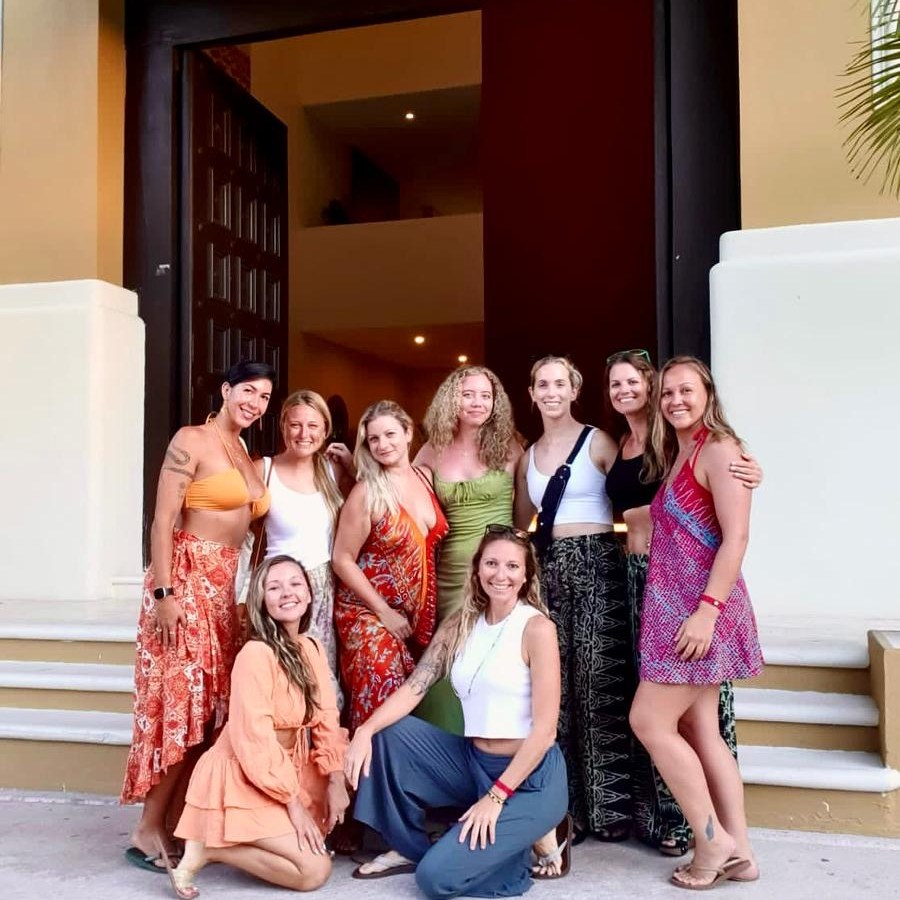 a group of people sitting posing for the camera