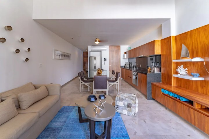 a living room filled with furniture and a table