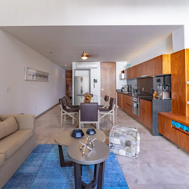 a living room filled with furniture and a table