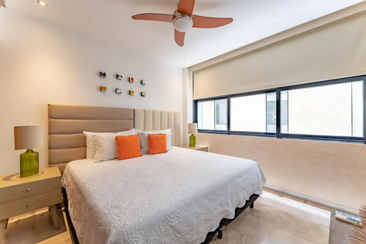 a bedroom with a large bed in a hotel room