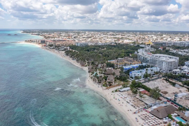 a view of a beach next to a body of water