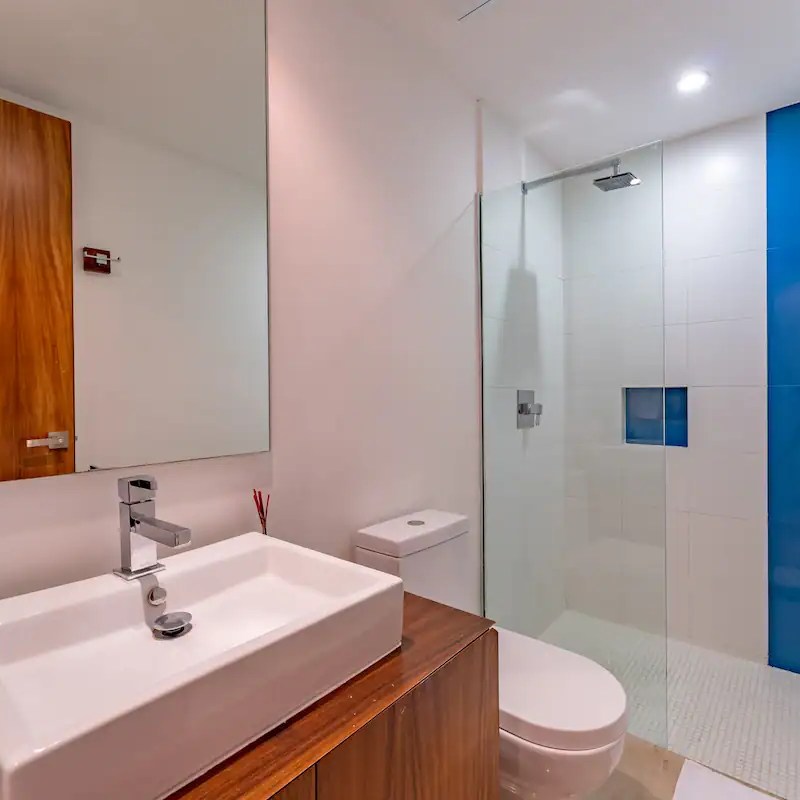 a room with a sink and a mirror