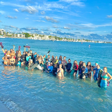 women snorkeling and freediving