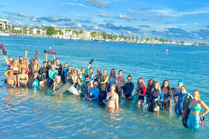 women snorkeling and freediving