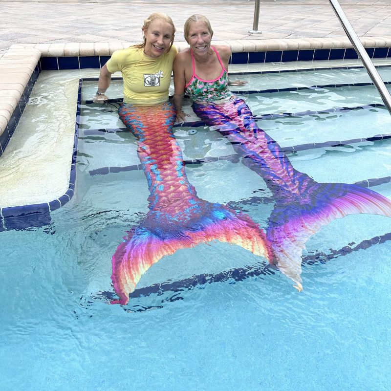 a child swimming in a body of water