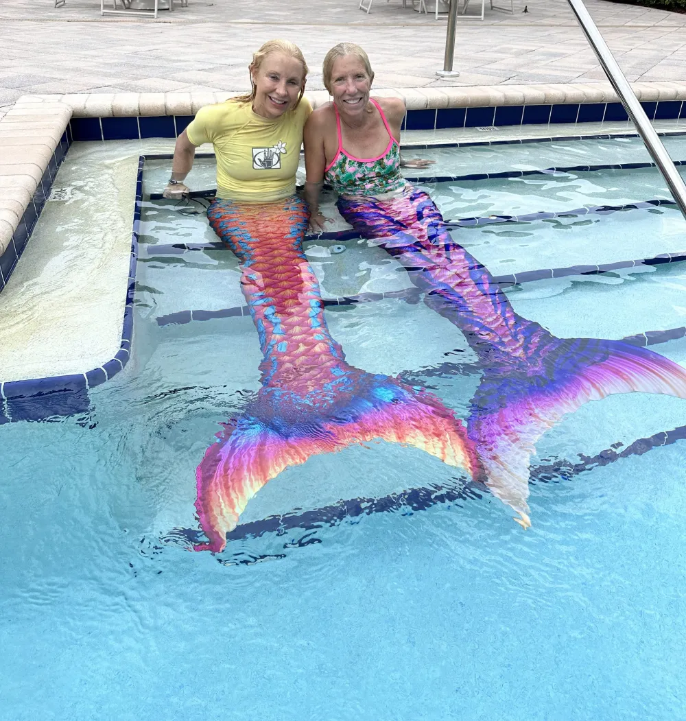 a child swimming in a body of water