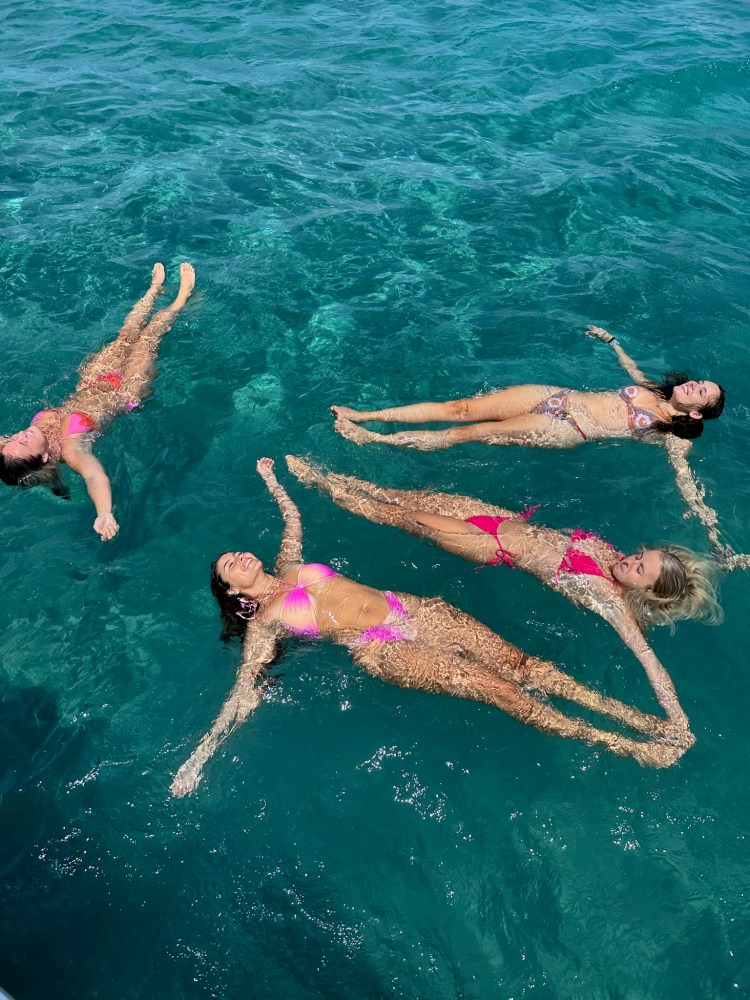 a group of people swimming in the water
